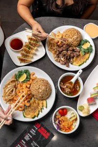 a plate of food with chopsticks