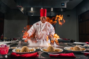 a chef cooking food in a kitchen